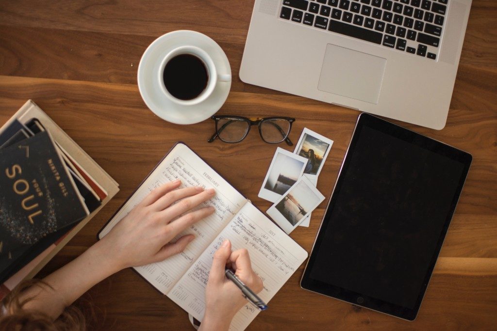 Desk with open notebook - writing